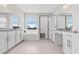 Bright bathroom featuring a soaking tub, walk-in shower, dual sinks, and granite countertops at 2724 Coco Palm Cir, Wesley Chapel, FL 33543