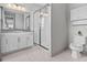Bathroom featuring tiled floors, shower and toilet at 2724 Coco Palm Cir, Wesley Chapel, FL 33543