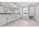 Bright bathroom featuring a soaking tub, walk-in shower, dual sinks, and granite countertops at 2724 Coco Palm Cir, Wesley Chapel, FL 33543