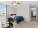The bedroom has neutral carpet and lots of light from the window at 2724 Coco Palm Cir, Wesley Chapel, FL 33543