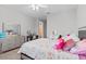 Large bedroom with a rainbow themed bed and a desk at 2724 Coco Palm Cir, Wesley Chapel, FL 33543