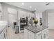 Stylish kitchen featuring stainless steel appliances, granite countertops and white cabinets at 2724 Coco Palm Cir, Wesley Chapel, FL 33543