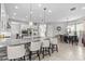 Elegant kitchen with granite countertops, island seating, and stainless steel appliances at 2724 Coco Palm Cir, Wesley Chapel, FL 33543