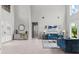 Bright foyer with tall ceilings, a stylish mirror, and ample natural light at 2724 Coco Palm Cir, Wesley Chapel, FL 33543