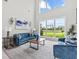 Living room boasts soaring ceilings and scenic backyard views at 2724 Coco Palm Cir, Wesley Chapel, FL 33543
