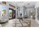 Inviting lobby with tile flooring, stylish seating, and a view of the community at 2724 Coco Palm Cir, Wesley Chapel, FL 33543