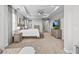 Spacious main bedroom with tray ceiling, with view to the en suite bathroom at 2724 Coco Palm Cir, Wesley Chapel, FL 33543