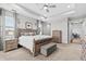 Large main bedroom featuring tray ceiling and a seating area in background at 2724 Coco Palm Cir, Wesley Chapel, FL 33543