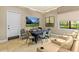Media room with theatre seating, a table, and a large-screen TV for entertainment at 2724 Coco Palm Cir, Wesley Chapel, FL 33543