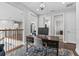 This home features a second floor office space with wood floors and dark wood desk at 2724 Coco Palm Cir, Wesley Chapel, FL 33543