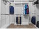 Walk-in closet with hanging clothes and shelf storage at 2724 Coco Palm Cir, Wesley Chapel, FL 33543