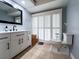 Elegant bathroom featuring a sleek vanity, modern fixtures, and ample natural light at 3005 Wilton Ln, Valrico, FL 33596