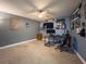 Spacious bedroom with ceiling fan, gray walls, carpet flooring and decorated with sports memorabilia at 3005 Wilton Ln, Valrico, FL 33596