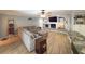 Spacious living room featuring a fireplace, built-in shelves, and comfortable seating at 3005 Wilton Ln, Valrico, FL 33596