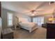 Serene bedroom featuring a plush bed, natural light, and a comfortable sitting area at 3005 Wilton Ln, Valrico, FL 33596
