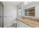 Bathroom features a vanity, granite countertop, and a shower with a new glass door at 3121 Egret Ter, Safety Harbor, FL 34695