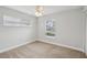 Bright bedroom with two windows offering natural light and a ceiling fan for added comfort at 3121 Egret Ter, Safety Harbor, FL 34695