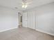 Spacious bedroom with neutral tones, ceiling fan, and ample closet space, offering a serene and comfortable living space at 3121 Egret Ter, Safety Harbor, FL 34695