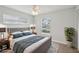 Relaxing bedroom featuring a comfortable bed, ample natural light, and modern decor, creating a serene and inviting atmosphere at 3121 Egret Ter, Safety Harbor, FL 34695