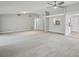 Spacious living room with plush carpet, lots of natural light, and a view into the kitchen at 3121 Egret Ter, Safety Harbor, FL 34695