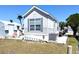 Charming single-Gathering home with a patio area, ladder, and outdoor grill at 35152 Dodie, Zephyrhills, FL 33541