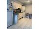 Bright kitchen with white appliances, tile flooring, and good countertop space at 3802 Cortez Cir # D, Tampa, FL 33614