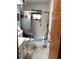 Bathroom with walk-in shower, safety bars and seating. Handicapped accessibility at 39343/39349 Rusbe, Zephyrhills, FL 33540