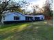 Lovely single story home with a sprawling front yard and screened lanai at 39343/39349 Rusbe, Zephyrhills, FL 33540