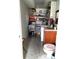 Room showing second toilet, rolling office chair, sink, and storage shelves at 39343/39349 Rusbe, Zephyrhills, FL 33540