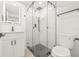 Beautifully renovated bathroom featuring a glass shower, sleek vanity, and modern fixtures at 4220 E Regnas Ave, Tampa, FL 33617
