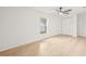 Bright bedroom featuring a ceiling fan, large window, and spacious closet at 4220 E Regnas Ave, Tampa, FL 33617