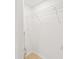 Walk-in closet with wood floors and wire shelving at 4220 E Regnas Ave, Tampa, FL 33617