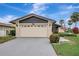 Home's exterior shows a two-car garage, manicured landscaping, and an American flag at 4512 Superior Ln, Clearwater, FL 33762