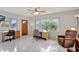 Bright office space with tile floors, desk, and cozy recliner creates a productive work environment at 4512 Superior Ln, Clearwater, FL 33762