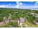 An aerial view of the property in a neighborhood with the bay in the background at 4640 W Lamb Ave, Tampa, FL 33629