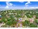 Aerial view of the property with views of the bay and surrounding neighborhood at 4640 W Lamb Ave, Tampa, FL 33629