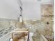 Partially renovated bathroom featuring a tiled shower, toilet, and space for a vanity at 4640 W Lamb Ave, Tampa, FL 33629