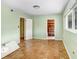 Spacious bedroom with hardwood floors, a window, and access to other rooms at 4640 W Lamb Ave, Tampa, FL 33629