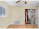 Bedroom features parquet floors, natural light, and a closet under renovation at 4640 W Lamb Ave, Tampa, FL 33629