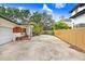 Features a spacious driveway leading to the garage, complete with a covered front porch enhanced by decorative details at 4640 W Lamb Ave, Tampa, FL 33629