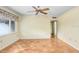 Sunny living room with parquet floors and natural light at 4640 W Lamb Ave, Tampa, FL 33629