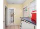 Mud room area features tile flooring, ample counter space, and access to additional rooms at 4640 W Lamb Ave, Tampa, FL 33629