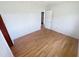 Bright bedroom featuring wood-look floors, and a freshly painted neutral color palette at 4722 Harris Ave, Sarasota, FL 34233