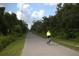 Scenic bike path surrounded by lush greenery, perfect for outdoor recreation and exercise at 4722 Harris Ave, Sarasota, FL 34233