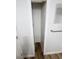 Narrow walk-in closet with wood floors at 4722 Harris Ave, Sarasota, FL 34233