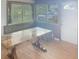 The dining room featuring a wooden table, a window with backyard view, and an entryway at 4722 Harris Ave, Sarasota, FL 34233