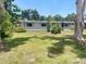 This is a charming single-story home with a well-maintained lawn and mature landscaping at 4722 Harris Ave, Sarasota, FL 34233