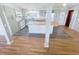 Open concept kitchen featuring updated appliances, a kitchen island, and gray flooring at 4722 Harris Ave, Sarasota, FL 34233