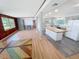 Open concept living space with a kitchen island, updated appliances, and wood countertops at 4722 Harris Ave, Sarasota, FL 34233