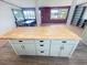 Kitchen island with painted cabinets and drawers in an open-concept kitchen at 4722 Harris Ave, Sarasota, FL 34233